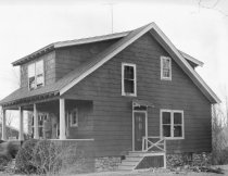 Sawyer Lumber Company--Exterior of bungalow with broken wndows